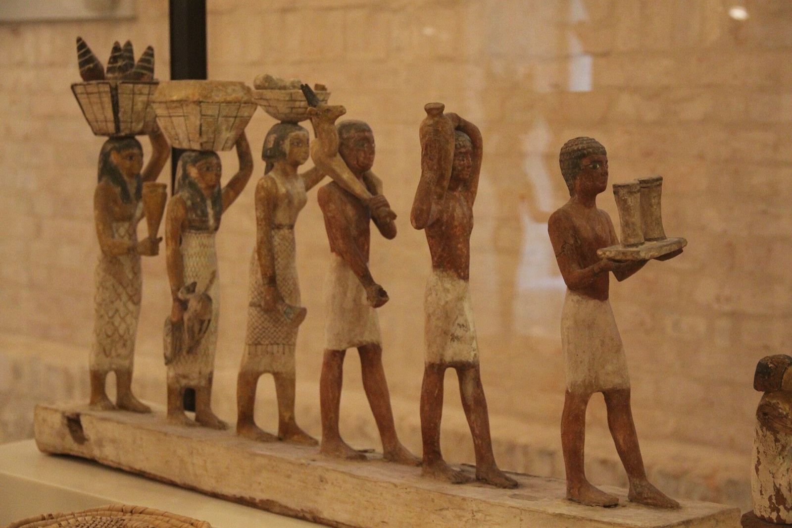 Wooden model showing ancient Egyptian farm workers